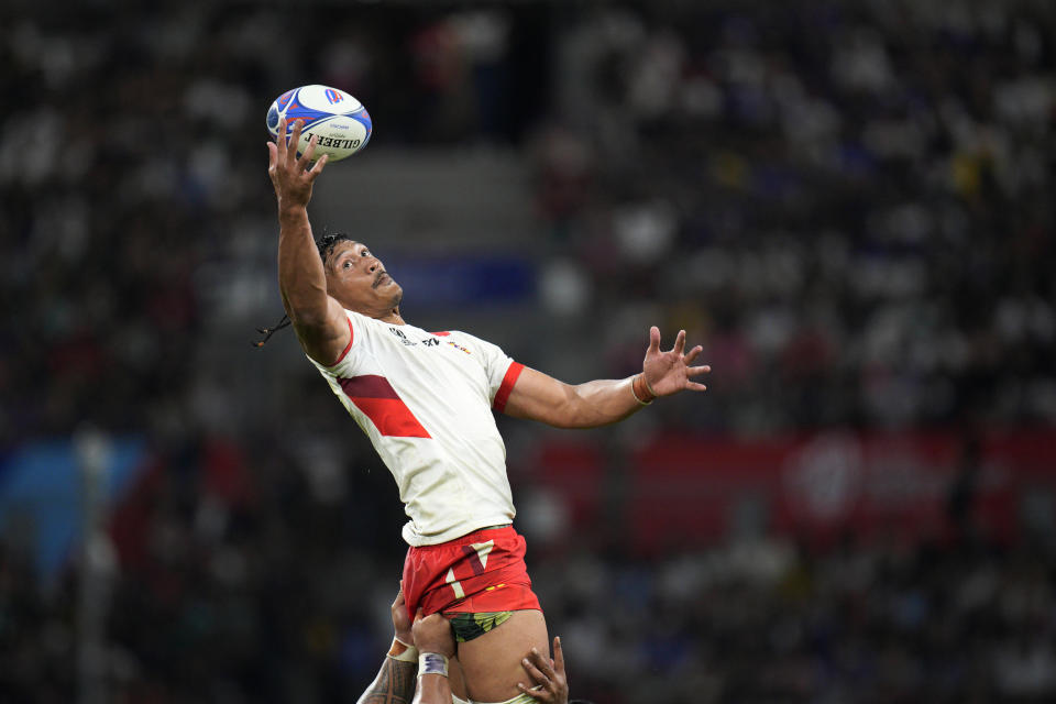 Tonga's Anzelo Tuitavuki wins a line out during the Rugby World Cup Pool B match between South Africa and Tonga at the Marseille's Stade Velodrome, in Marseille, France Sunday, Oct. 1, 2023. (AP Photo/Daniel Cole)