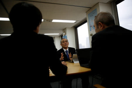 Yasuhiro Furuse, a senior adviser of corporate sales headquarters of Orix Corp., speaks with his colleagues at a meeting room in Tokyo, Japan, February 19, 2019. REUTERS/Kim Kyung-hoon/Files