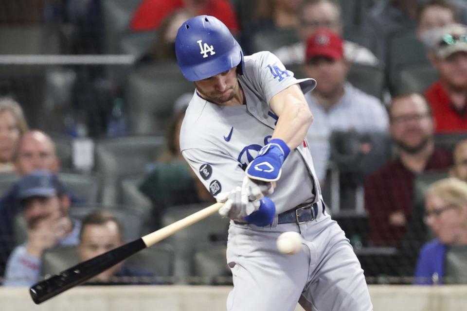 The Dodgers' Trea Turner hits a single