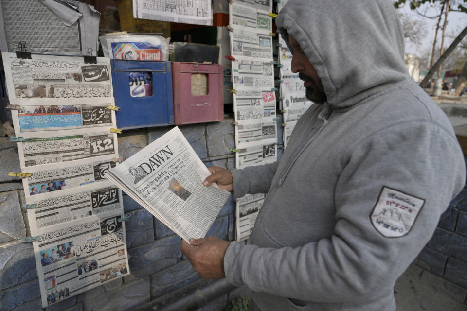A Pakistani reads morning newspaper covering front page story of Iran's strike, at a stall in Islamabad, Pakistan, Thursday, Jan. 18, 2024. Pakistan's air force launched retaliatory airstrikes early Thursday on Iran allegedly targeting militant positions, an attack that killed at least several people and further raised tensions between the neighboring nations. (AP Photo/Anjum Naveed)