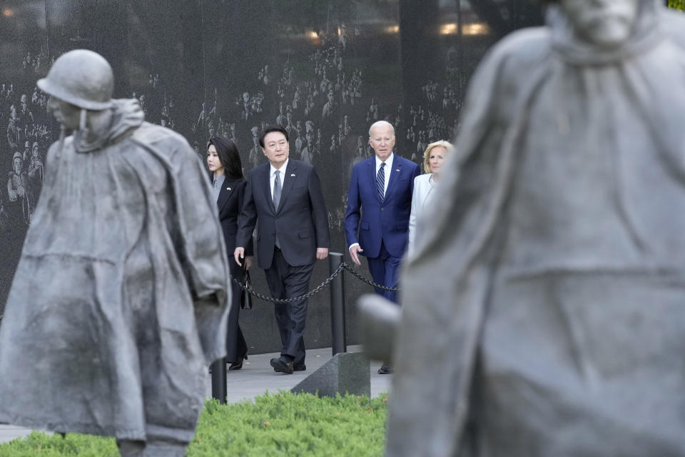 President Joe Biden, first lady Jill Biden, South Korea's President Yoon Suk Yeol and his wife Kim Keon Hee visit the Korean War Veterans Memorial in Washington, Tuesday, April 25, 2023. (AP Photo/Susan Walsh)