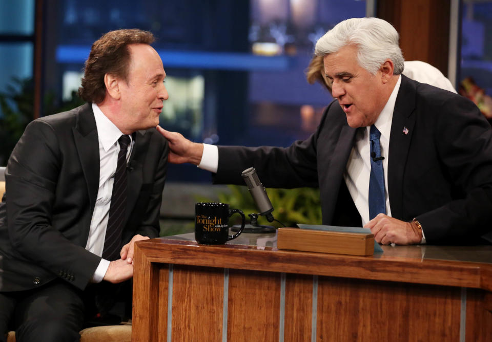 Jay Leno, right, and Billy Crystal appear during the final taping of NBC's “The Tonight Show with Jay Leno," in Burbank, Calif., Thursday, Feb. 6, 2014. Leno brings his 22-year career as the show host to an end Thursday in a special one-hour farewell broadcast. (Photo by Matt Sayles/Invision/AP)