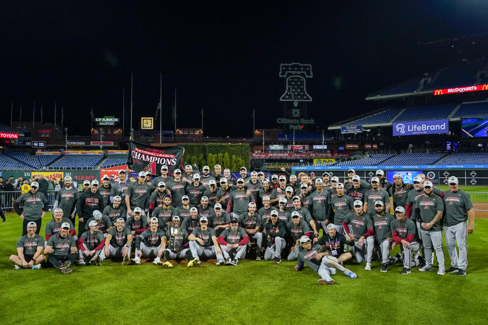 The Arizona Diamondbacks pose after their win against the Philadelphia Phillies in Game 7 of the baseball NL Championship Series in Philadelphia Tuesday, Oct. 24, 2023. (AP Photo/Matt Slocum)