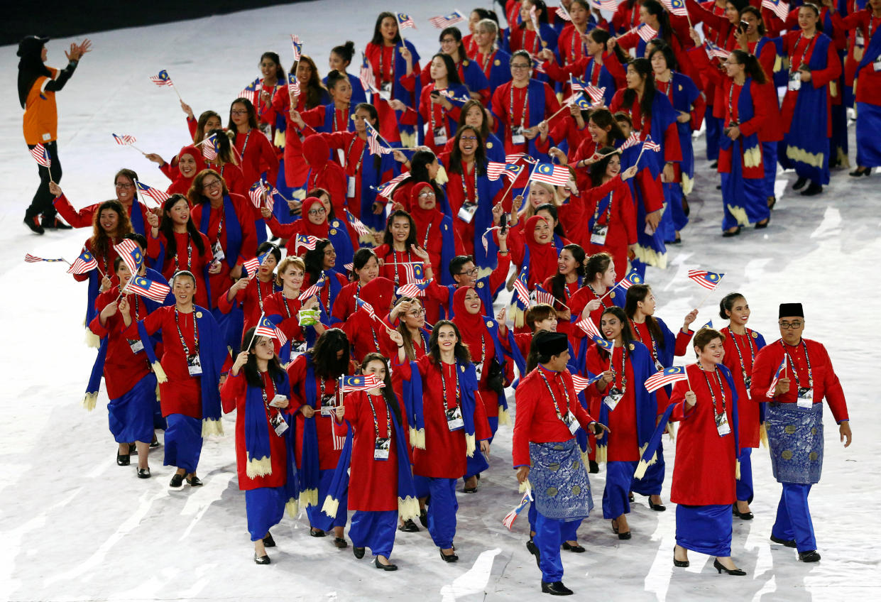 Malaysia’s contingent arrives at the Bukit Jalil National Stadium on 19 August for the 2017 SEA Games opening ceremony. (PHOTO: Reuters)