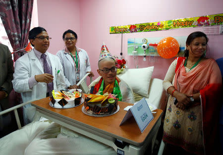 Taiwanese hiker Liang Sheng Yueh, who was lost in the Himalayas for over a month, celebrates his 21st birthday at a hospital after being rescued, in Kathmandu, Nepal April 28, 2017. REUTERS/Navesh Chitrakar