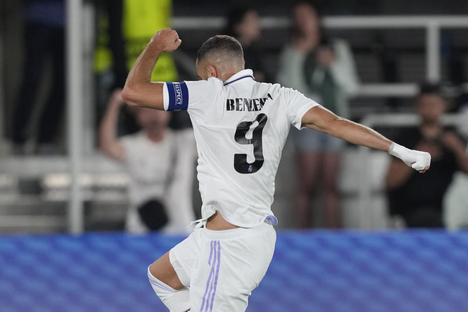 Real Madrid's Karim Benzema celebrates after scoring his side's second goal during the UEFA Super Cup final soccer match between Real Madrid and Eintracht Frankfurt at Helsinki's Olympic Stadium, Finland, Wednesday, Aug. 10, 2022. (AP Photo/Antonio Calanni)