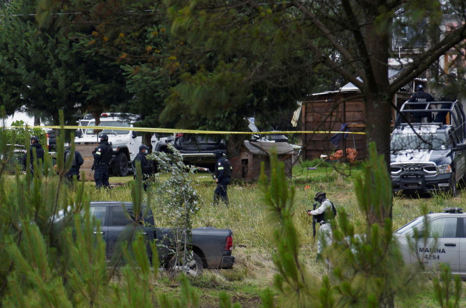 Federal forces are pictured at a scene following a shootout that left three security forces wounded and 10 suspected criminals killed, in Texcaltitlan, Mexico June 14, 2022. / Credit: STRINGER / REUTERS