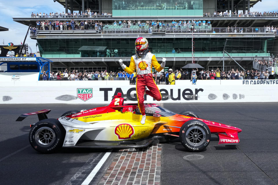 Josef Newgarden celebrates on the finish line after winning the Indianapolis 500 auto race at Indianapolis Motor Speedway in Indianapolis, Sunday, May 28, 2023. (AP Photo/AJ Mast)