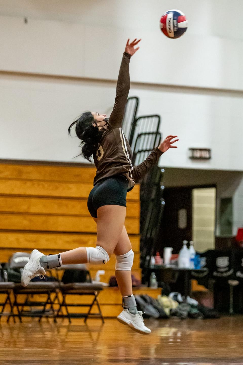 Westport’s Kyleigh Finglas (5) serves the ball.