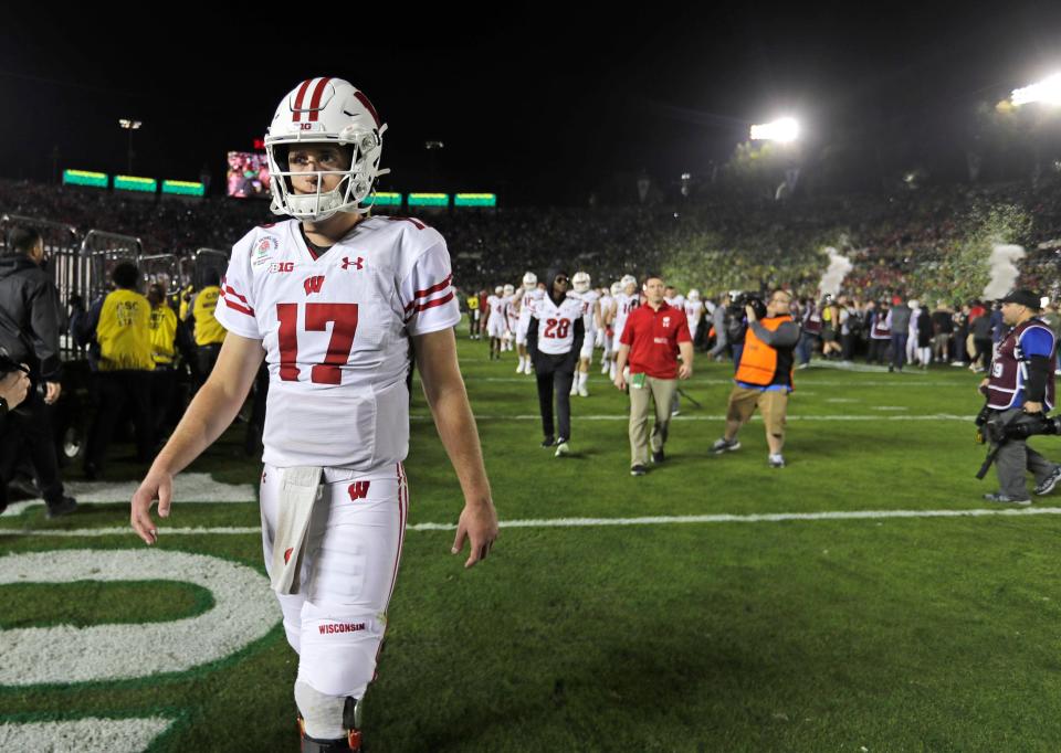 Badgers quarterback Jack Coan leaves the field after the Rose Bowl loss to Oregon. Credit: Rick Wood-Imagn Content Services, LLC