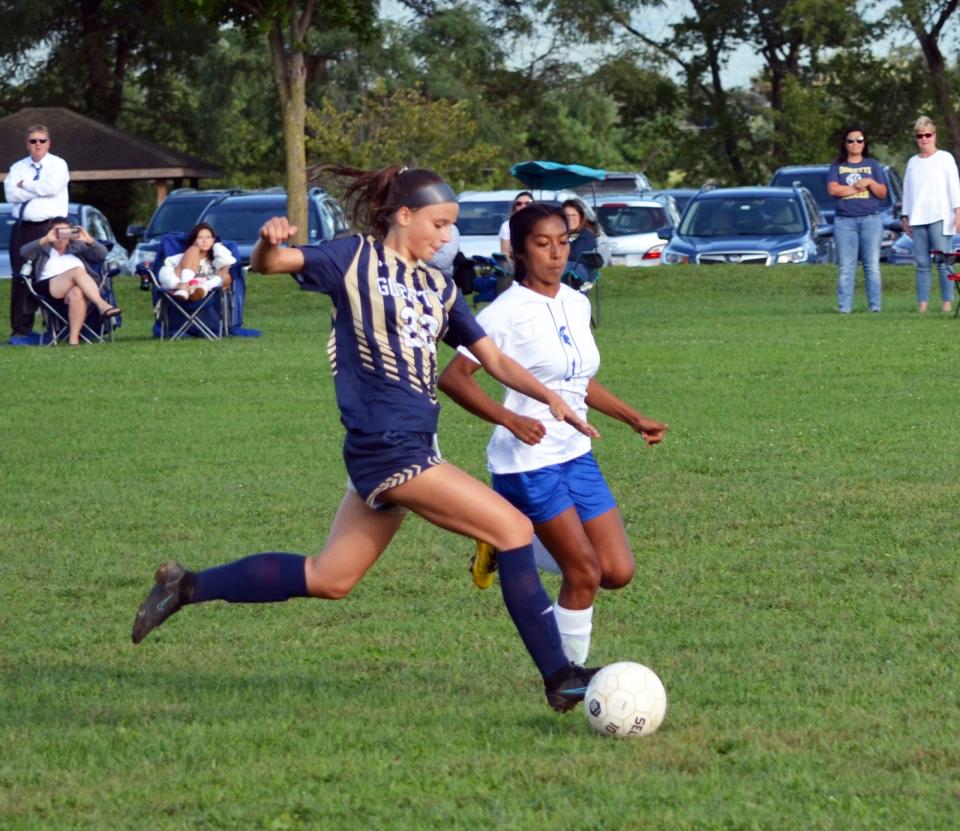 St. Maria Goretti's Jana Borchart gets by McConnellsburg's Faith Peck on her way to a second-half goal during the Gaels' 9-1 victory on Sept. 13, 2022.