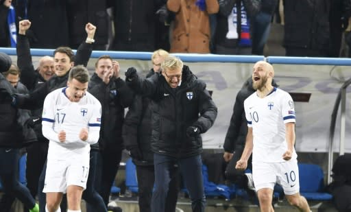 Finland celebrate qualifying for their first appearance at the finals of a major tournament