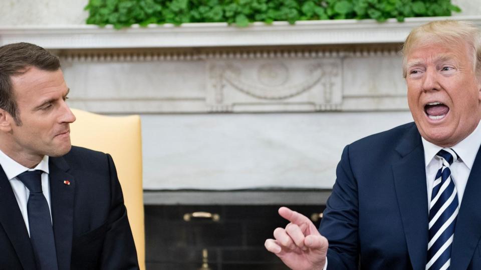 France's President Emmanuel Macron listens as U.S. President Donald Trump speaks to the press in the Oval Office of the White House April 24, 2018 in Washington, DC. (Photo credit should read BRENDAN SMIALOWSKI/AFP via Getty Images) (Brendan Smialowski/AFP via Getty Images)