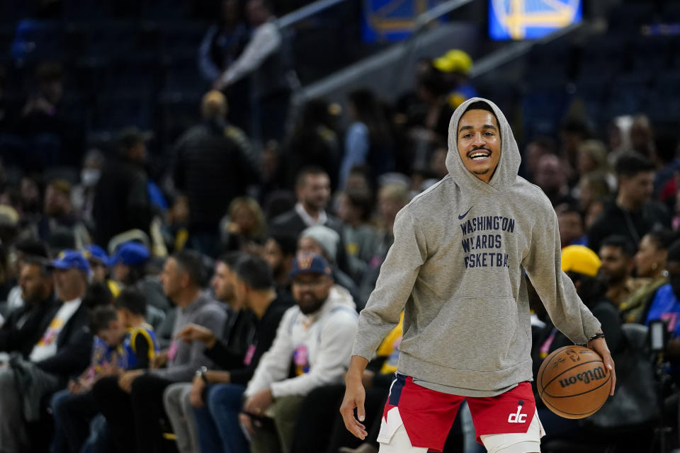 Washington Wizards guard Jordan Poole warms up for the team's NBA basketball game against the Golden State Warriors on Friday, Dec. 22, 2023, in San Francisco. (AP Photo/Godofredo A. Vásquez)