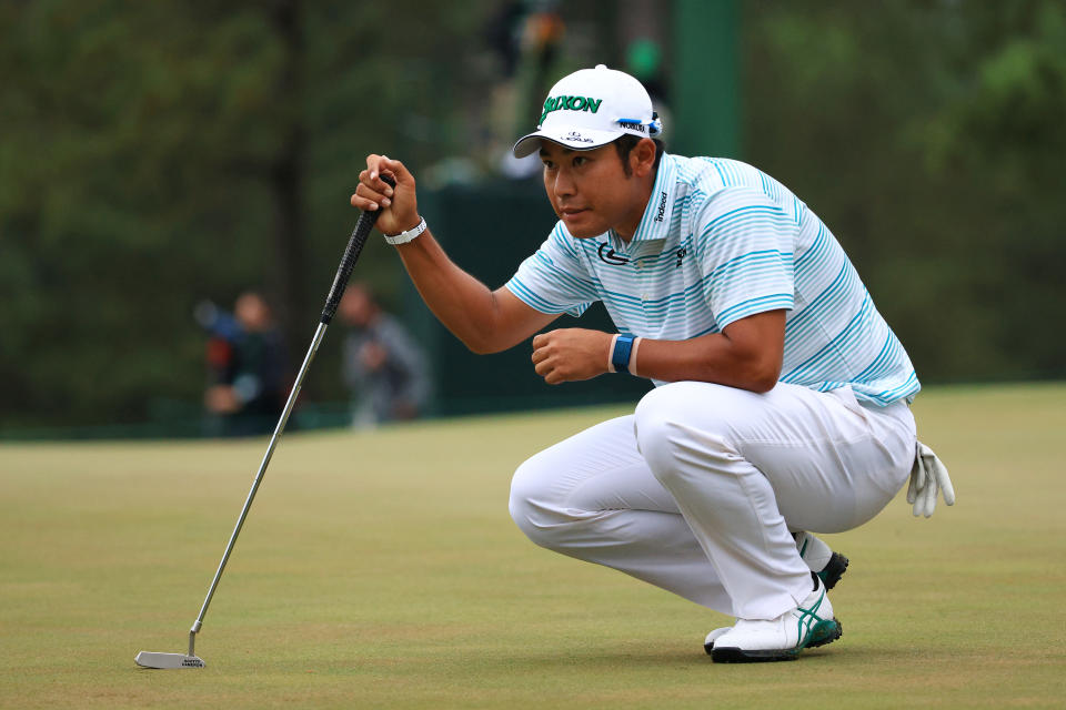 Hideki Matsuyama lines up a putt on the 17th green during the third round of the Masters. (Photo by Mike Ehrmann/Getty Images)