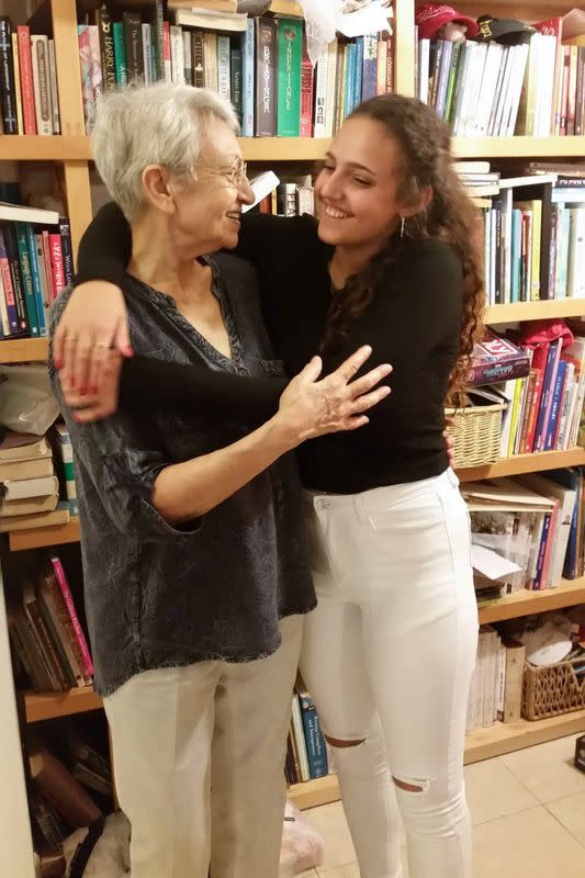 Romi Gonen, who was kidnapped from the Nova festival in the deadly October 7 attack by Palestinian Islamist group Hamas, hugs her grandmother Dvora Leshem in a handout image