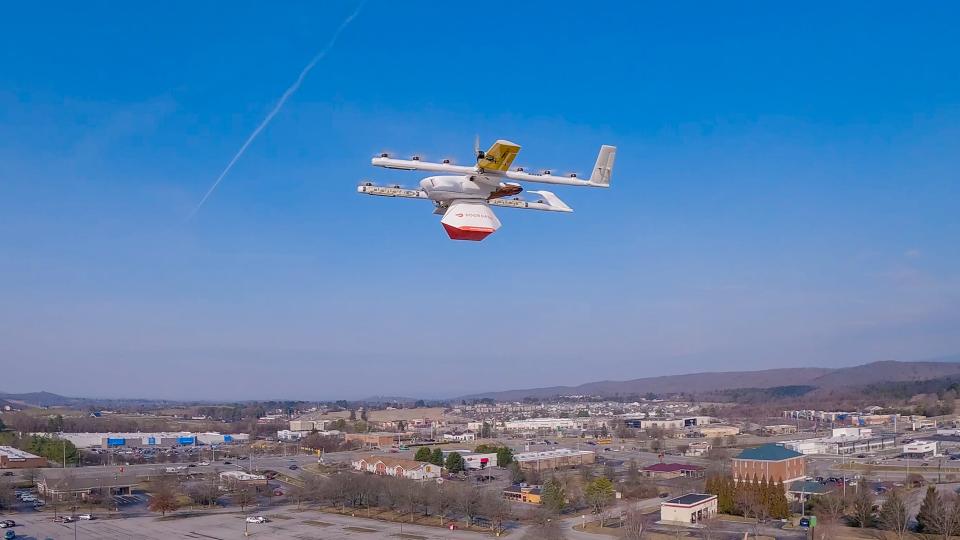 Drone flying in sky with DoorDash package