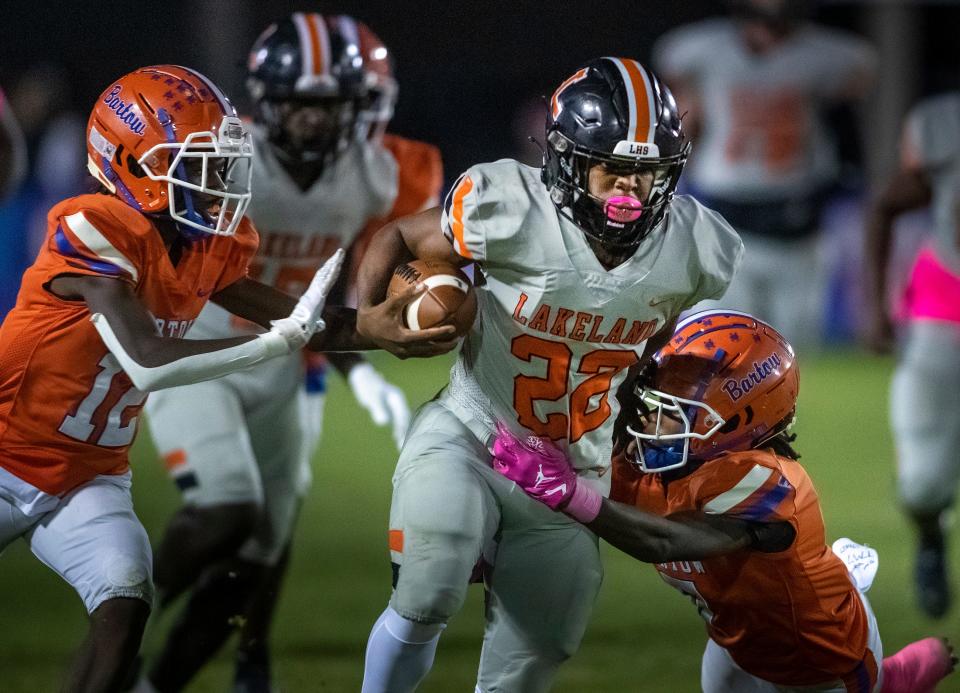 Lakeland Dreadnaughts (22) Markell Johnson is chased by Bartow defendersin first half action at Bartow High School In Bartow Fl. Thursday October 6,2022Ernst Peters/The Ledger