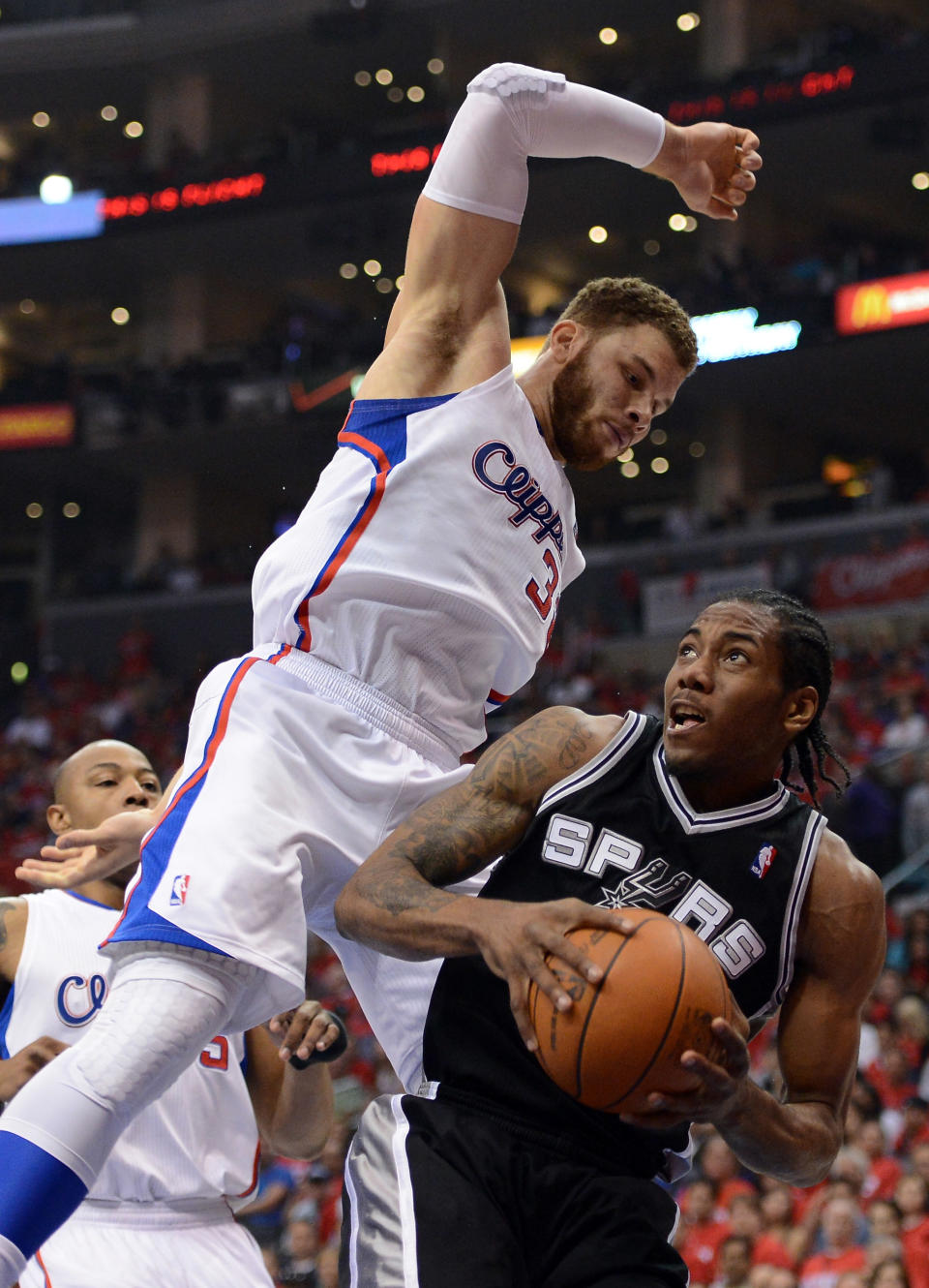 LOS ANGELES, CA - MAY 20: Kawhi Leonard #2 of the San Antonio Spurs looks to shoot against Blake Griffin #32 of the Los Angeles Clippers in the first quarter in Game Four of the Western Conference Semifinals in the 2012 NBA Playoffs on May 20, 2011 at Staples Center in Los Angeles, California. NOTE TO USER: User expressly acknowledges and agrees that, by downloading and or using this photograph, User is consenting to the terms and conditions of the Getty Images License Agreement. (Photo by Harry How/Getty Images)