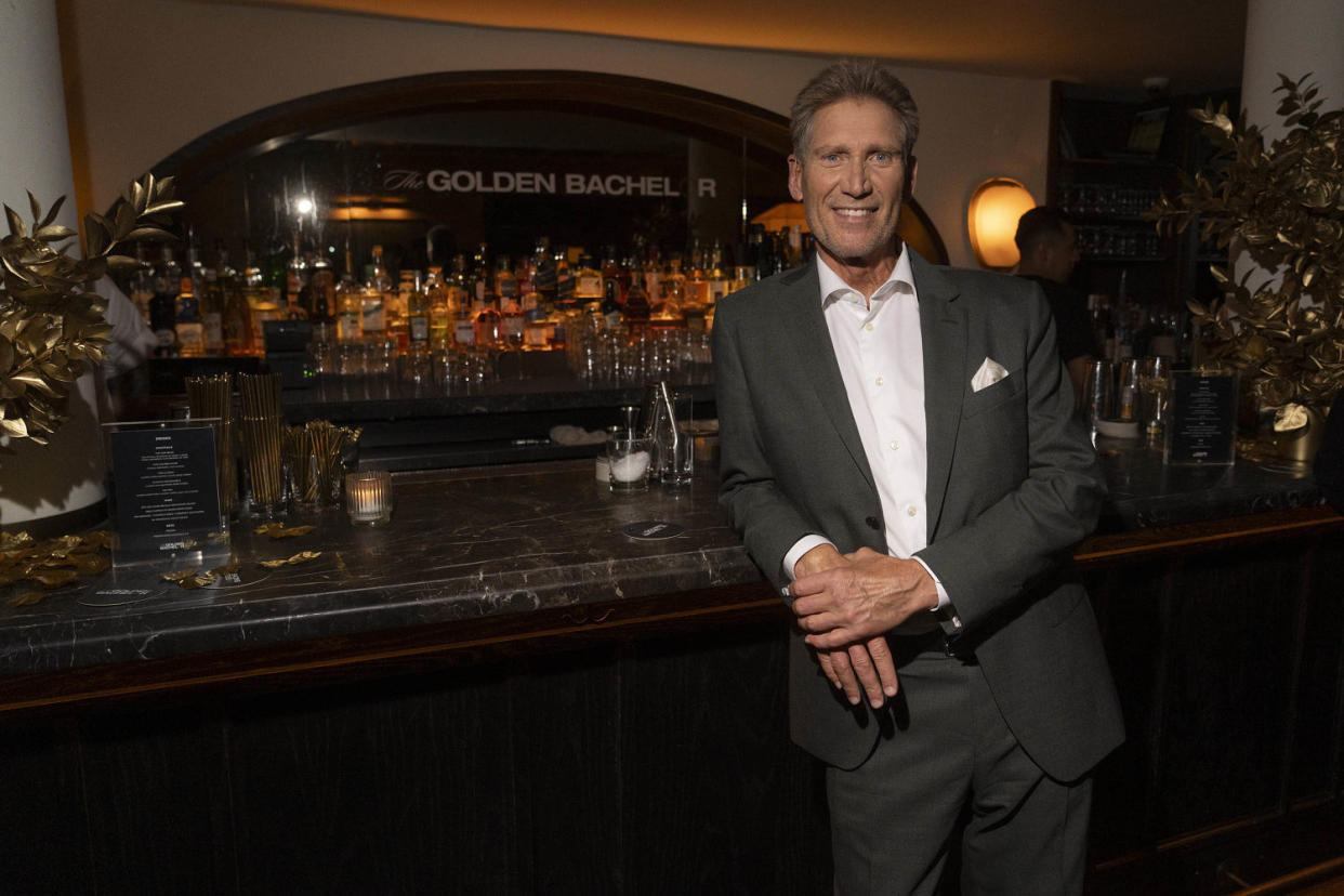 GERRY TURNER stands at a bar in a grey suit with a white shirt. (Ben Hider / ABC via Getty Images)