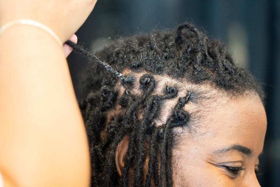 Kelly Livingston has her locs re-twisted by Adrienne Wakefield at Cheveux Adorn Hair and Nail.