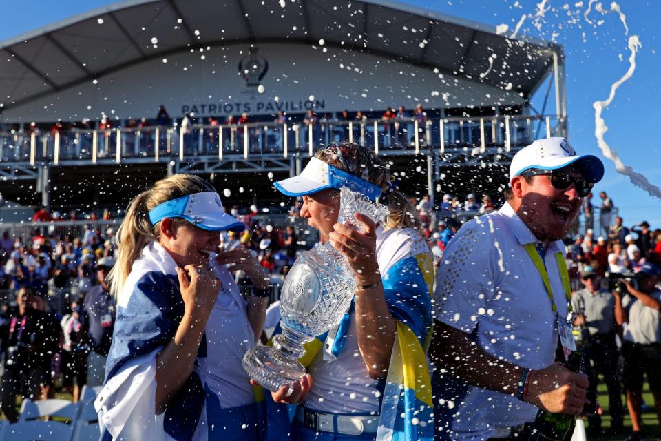 Team Europe stars Matilda Castren and Madelene Sagstrom celebrate with the Solheim Cup after beating Team USA in the event.