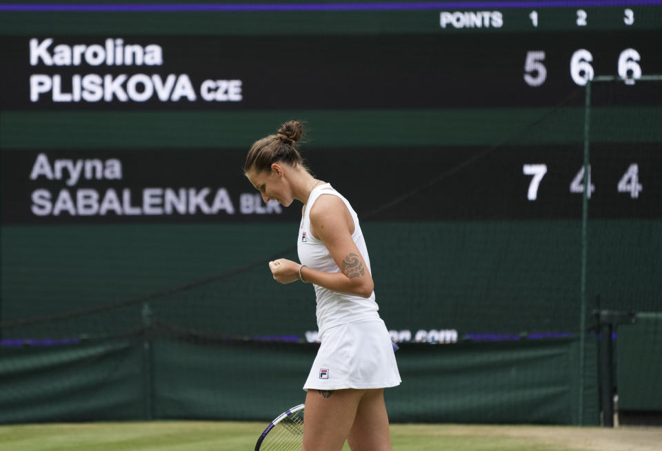 Czech Republic's Karolina Pliskova celebrates after defeating Aryna Sabalenka of Belarus during the women's singles semifinals match on day ten of the Wimbledon Tennis Championships in London, Thursday, July 8, 2021. (AP Photo/Alberto Pezzali)