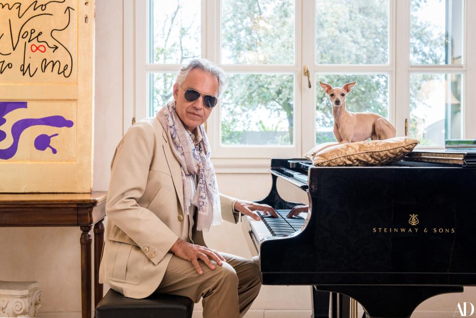 “She has a very sweet character and is an inseparable companion,” says Bocelli of his dog Katarina. The artwork is Gold Door by Marco Nereo Rotelli.