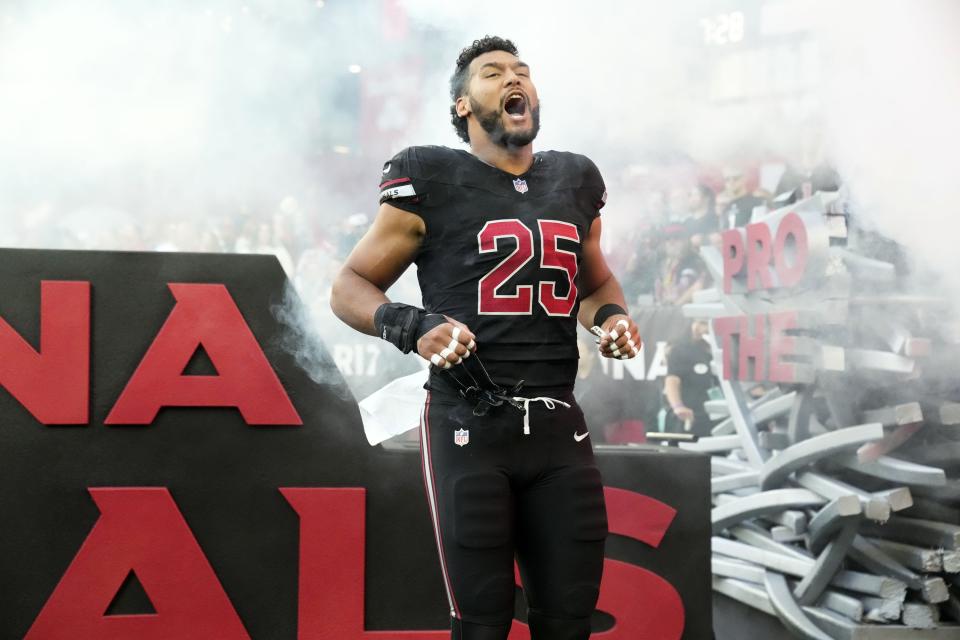 Arizona Cardinals linebacker Zaven Collins (25) during player introductions before facing the Los Angeles Rams at State Farm Stadium in Glendale on Nov. 26, 2023.