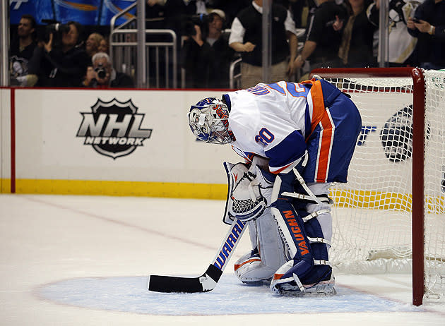 Pittsburgh Penguin goalie Marc-Andre Fleury blocks a shot in the first  period of the Penguins 5 to 3 win over the New York Rangers at the Mellon  Arena in Pittsburgh, Pennsylvania on