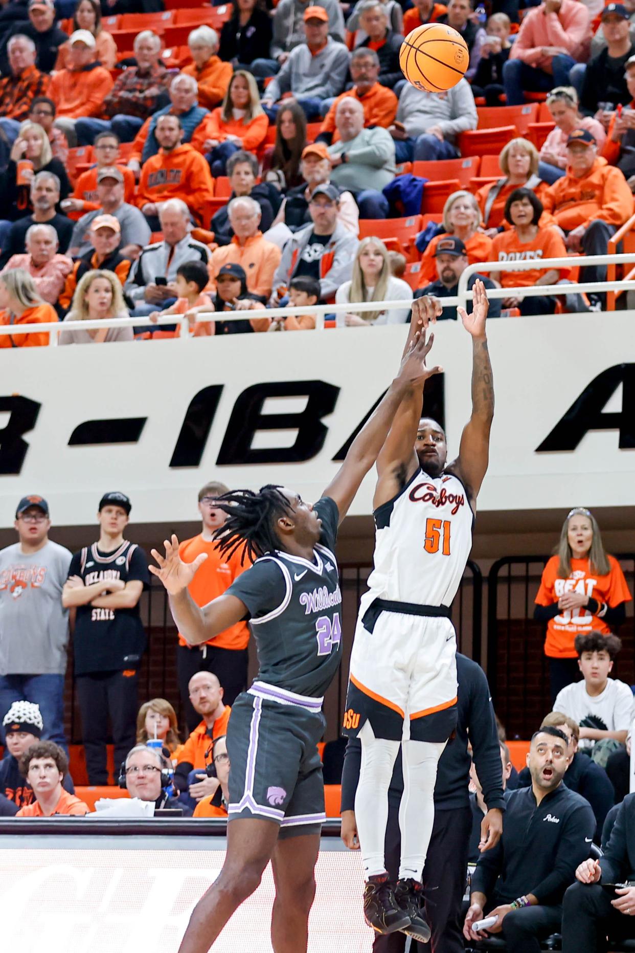 Oklahoma State guard John-Michael Wright (51) shoots a 3-pointer over Kansas State forward Arthur Kaluma (24) in the second half during an NCAA basketball game between Oklahoma State (OSU) and Kansas State (KSU) at the Gallagher-Iba Arena in Stillwater Okla., on Saturday, Feb. 3, 2024.