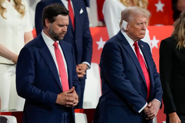 Sen. JD Vance (R-Ohio), left, and former President Donald Trump — the two men at the top of the GOP ticket amid the 2024 presidential election — pray during the Republican National Convention on Thursday, July 18, 2024, in Milwaukee.