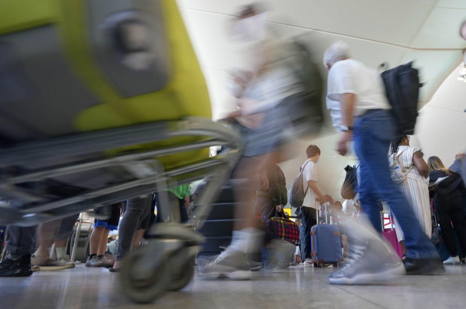 <span class="caption">Travellers queue at security at Heathrow Airport in London on June 22. People are likely to face travel disruptions until at least September.</span> <span class="attribution"><span class="source">(AP Photo/Frank Augstein)</span></span>