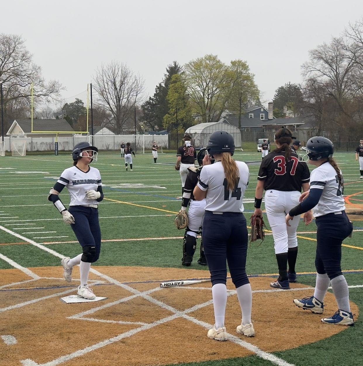 Manasquan's Elena Weinseimer crosses home after hitting her second inside-the-park home run of the game.