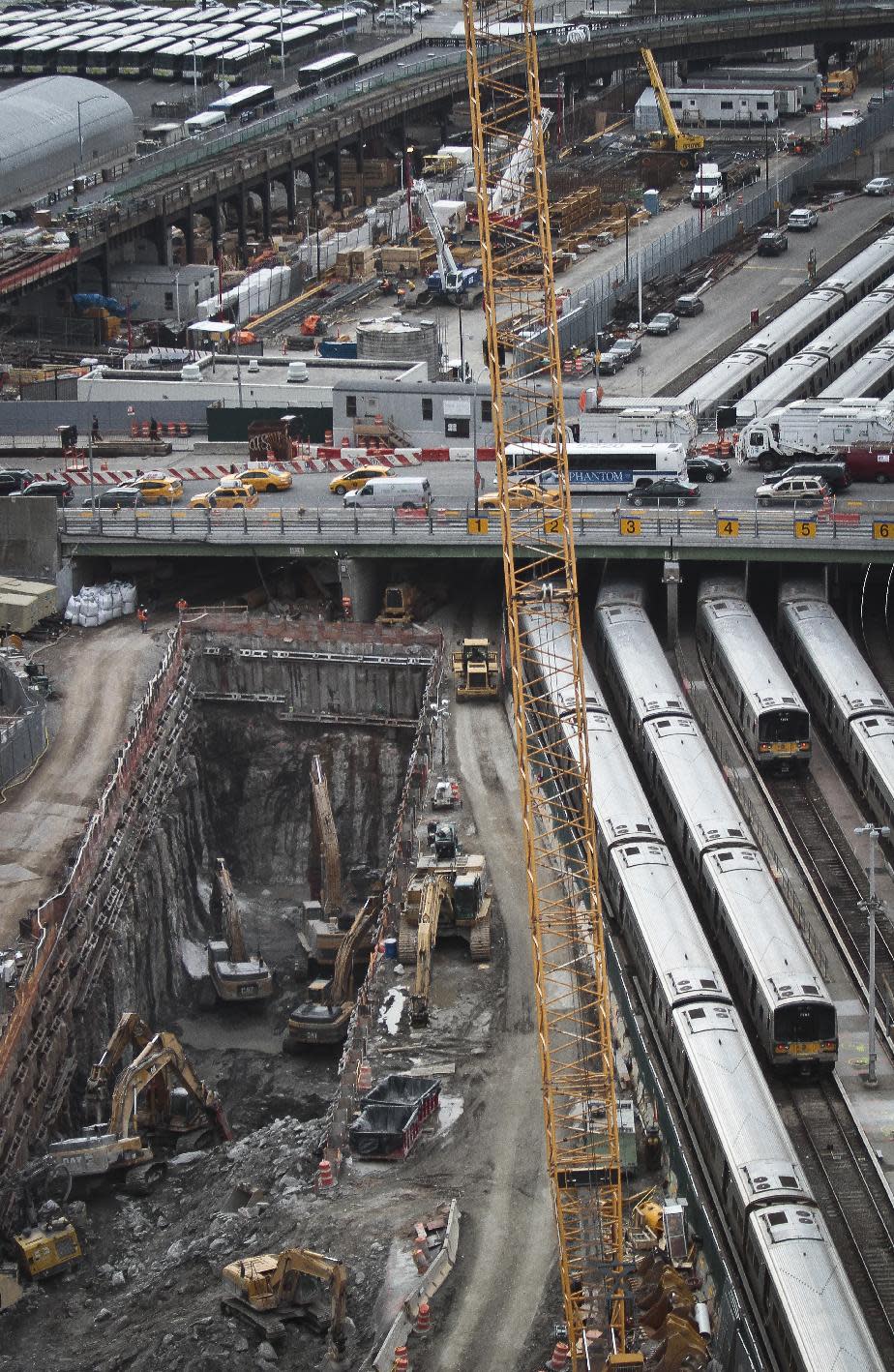 This photo made Thursday April 17, 2014, shows ongoing construction of a rail tunnel, left, at the Hudson Yards redevelopment site on Manhattan's west side in New York. Amtrak is constructing an 800-foot-long concrete box inside the project to preserve space for a tunnel from Newark to New York City that would allow it to double rail capacity across the Hudson River. (AP Photo/Bebeto Matthews)