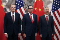 Chinese Vice Premier Liu He, right, poses with U.S. Treasury Secretary Steven Mnuchin, center, and U.S. Trade Representative Robert Lighthizer, left, before they proceed to their meeting at the Diaoyutai State Guesthouse in Beijing, Wednesday, May 1, 2019. (AP Photo/Andy Wong, Pool)