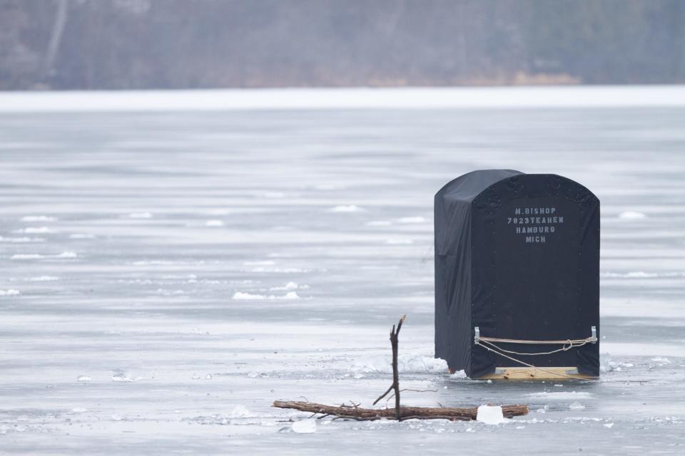 A single ice shanty stands near the Appleton Lake boat launch at Brighton Lake Recreation Area in Hamburg Township Thursday, Jan. 13, 2022.