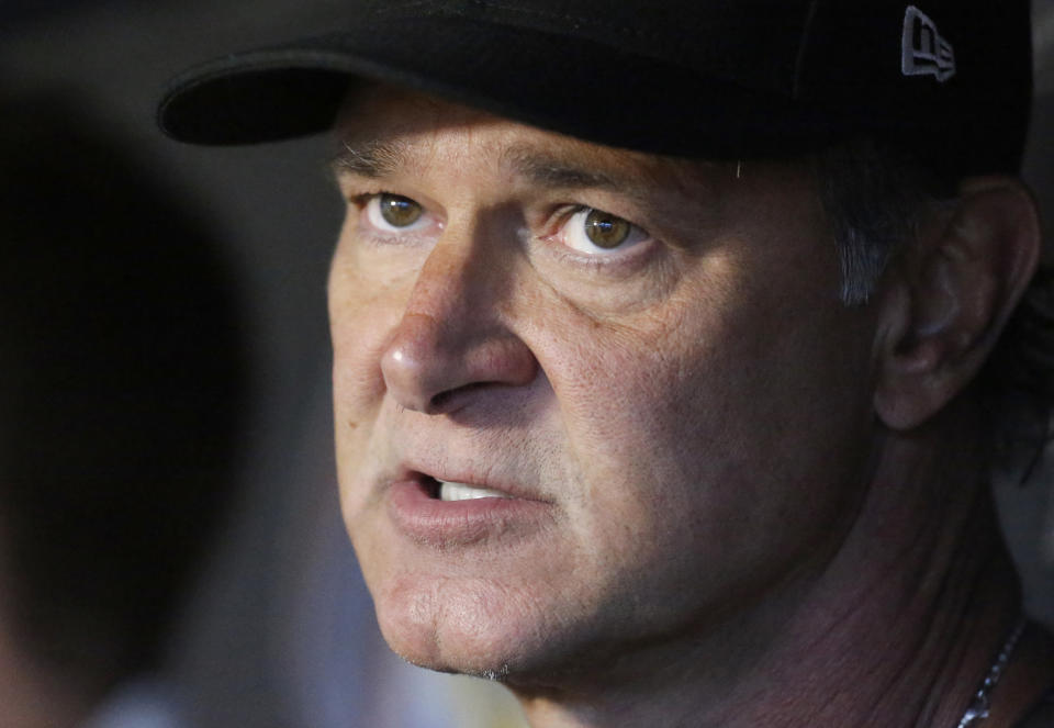 FILE - In this July 27, 2018, file photo, Miami Marlins manager Don Mattingly speaks with members of the media before the start of a baseball game against the Washington Nationals, in Miami. Mattingly says he's not dwelling on whether he belongs in the Hall of Fame. A day after Harold Baines was a surprising choice for the Hall, Mattingly says he's content knowing what he accomplished on the field. "I just didn't play long enough. Wasn't able to stay healthy long enough to really put that pile of numbers together," he said at the winter meetings in Las Vegas, Monday, Dec. 10, 2018. (AP Photo/Wilfredo Lee, File)