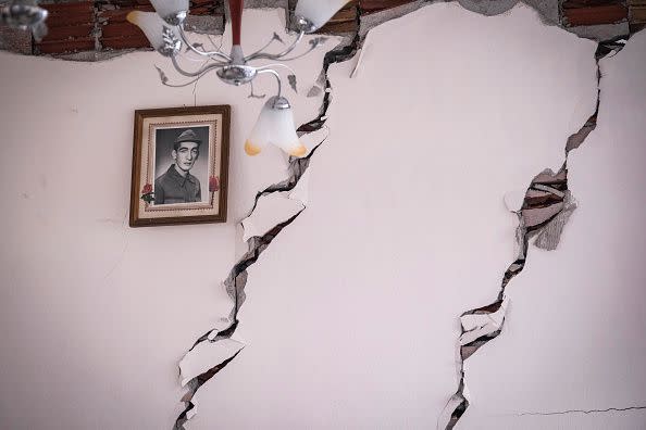 ELBISTAN, TURKEY - FEBRUARY 09: A framed portrait remains on a wall of a collapsed building on February 9, 2023 in Elbistan Turkey. A 7.8-magnitude earthquake hit near Gaziantep, Turkey, in the early hours of Monday, followed by another 7.5-magnitude tremor just after midday. The quakes caused widespread destruction in southern Turkey and northern Syria and were felt in nearby countries.  (Photo by Mehmet Kacmaz/Getty Images)