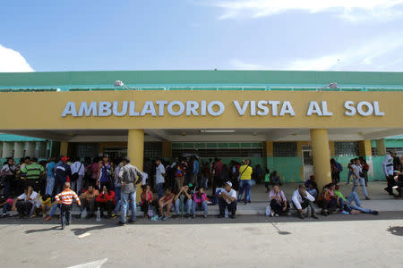 People gather outside a health center as they wait to get treatment for malaria, in San Felix, Venezuela November 7, 2017. Picture taken November 7, 2017. REUTERS/William Urdaneta