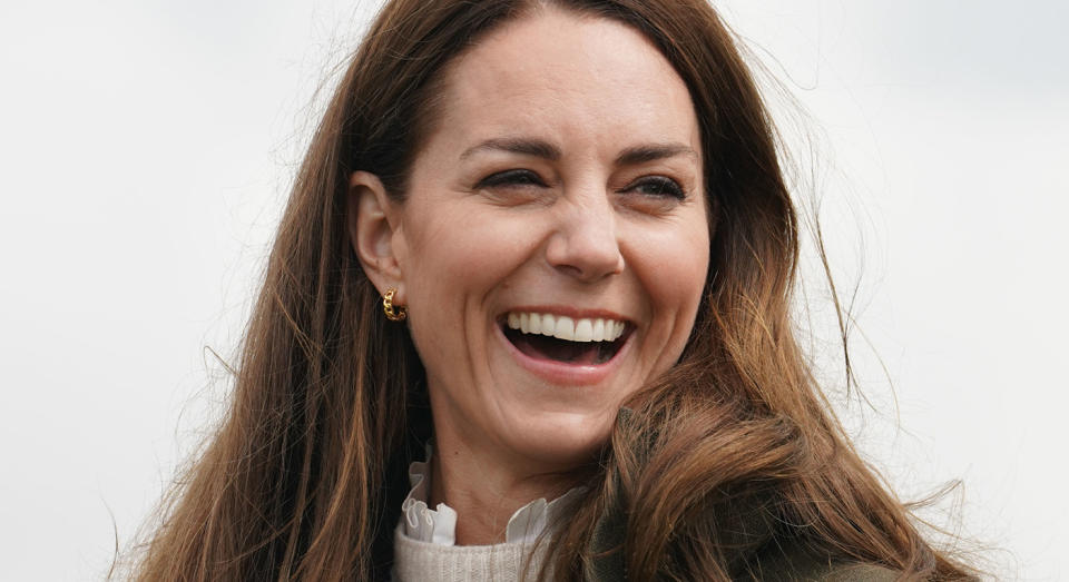 The Duchess of Cambridge has been styling a frilly blouse underneath jumpers, and this trend is here to stay.  (Getty images)