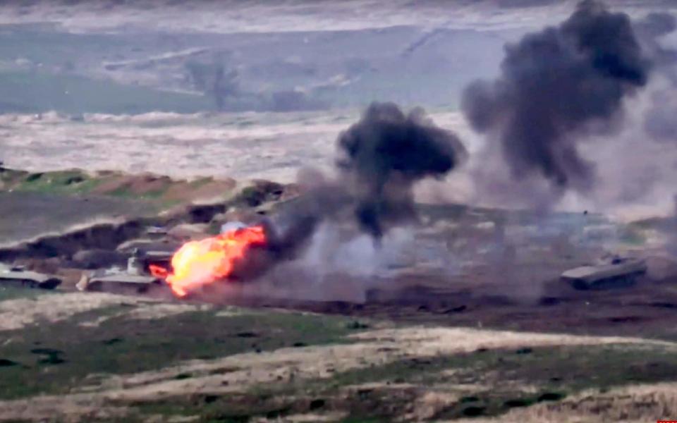 Footage released by the Armenian defence ministry showed an Azerbaijani military vehicle being destroyed - Armenian Defense Ministry via AP