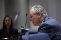 Pacific Gas and Electric Company (PG&E) CEO Bill Johnson speaks during a California Public Utilities Commission meeting in San Francisco, Friday, Oct. 18, 2019. (AP Photo/Jeff Chiu)