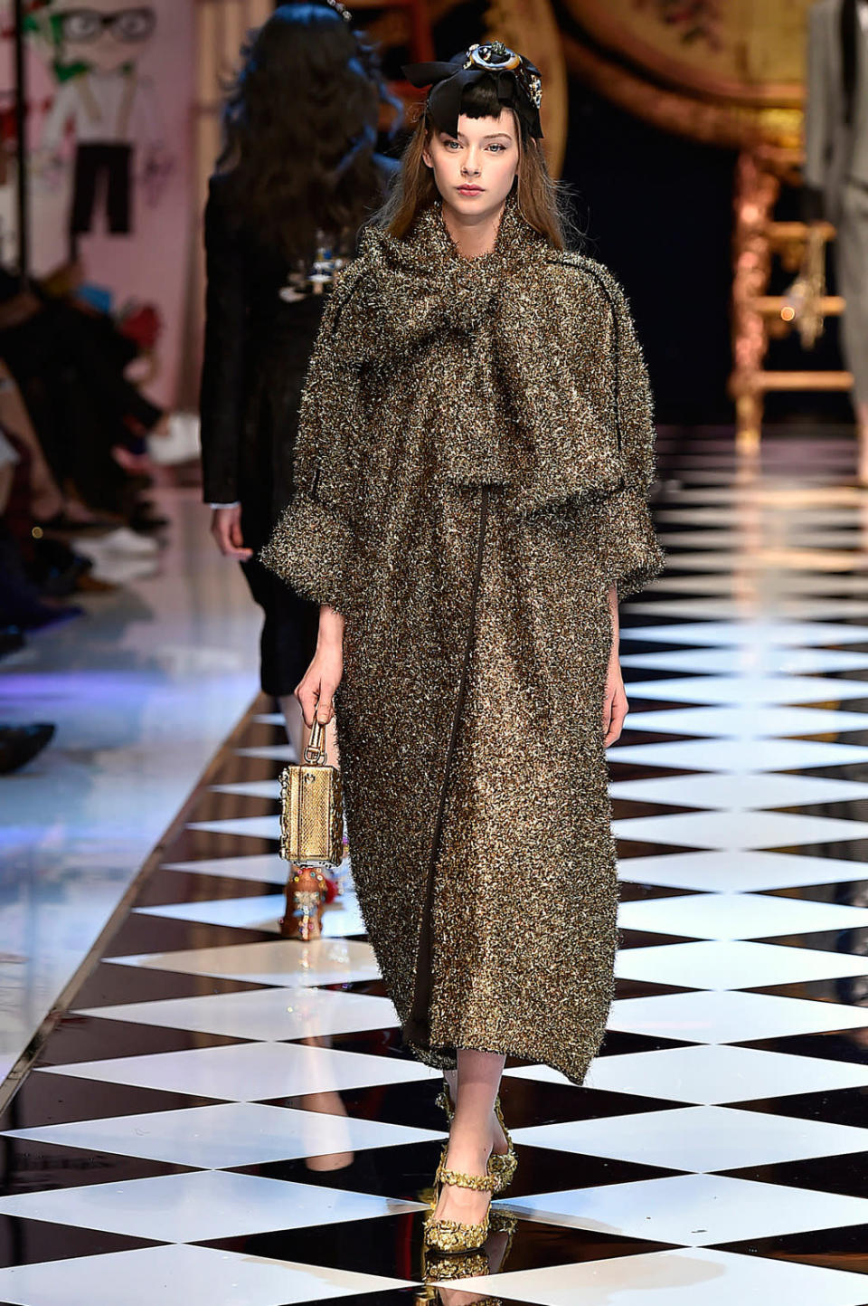 Dolce & Gabbana’s gold tinsel coat. (Photo by Catwalking/Getty Images)