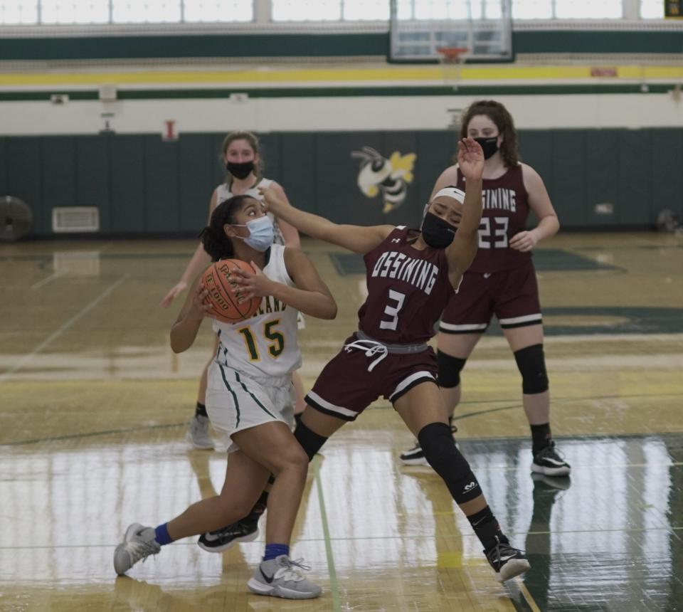 Lakeland guard Tyler Hormazabal (15)  collides with Ossining's Tamia Dimmie in the second half on Feb. 15, 2021. The Pride opened a 25-point lead six minutes into the second half.