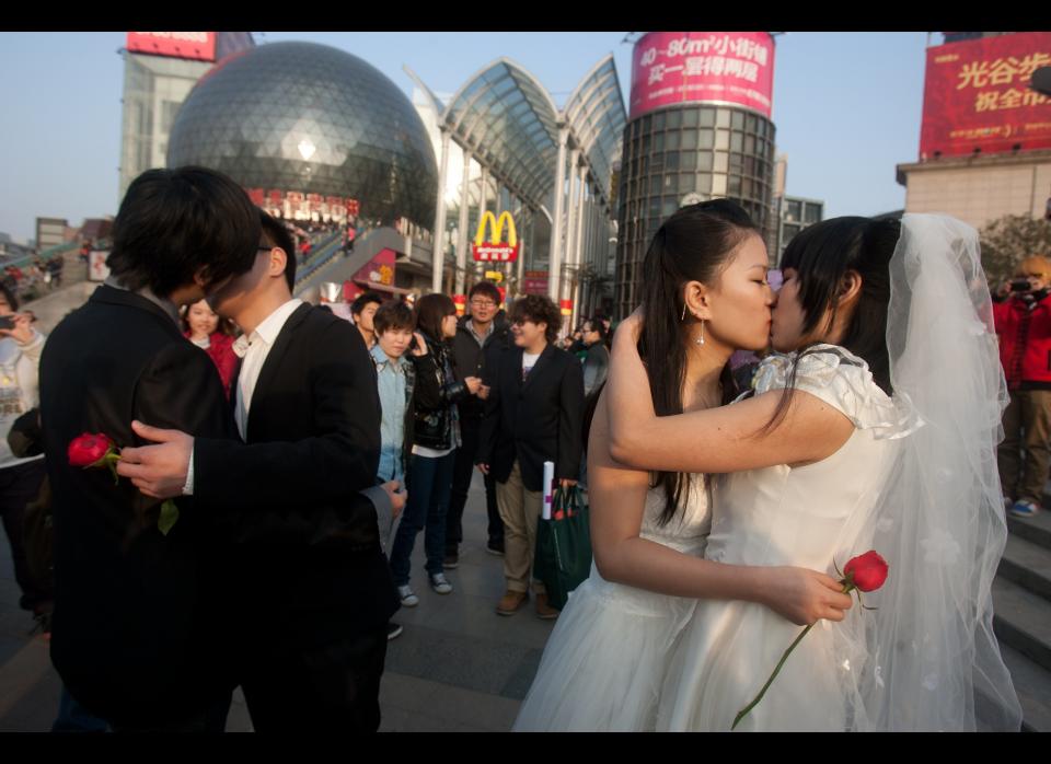 In March 2011, gay couples kiss during a ceremonial 'wedding' as they try to raise awareness of the issue of homosexual marriage, in Wuhan, in central China's Hubei province. 