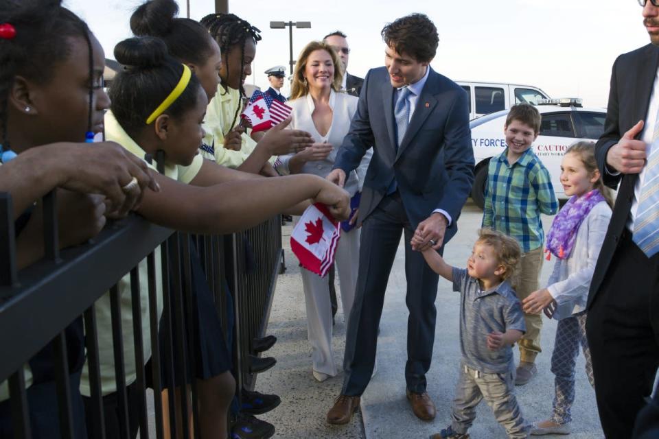 Canadian Prime Minister Justin Trudeau and his wife Sophie Grégoire-Trudeau, and their children, greet students from Paterson Elementary School, in Washington, as they arrive at Andrews Air Force Base, Md., Wednesday, March 9, 2016. AP Photo/Cliff Owen