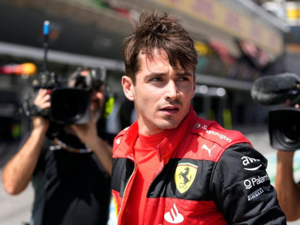 Charles Leclerc reacts in the pitlane after his retirement at the Spanish Grand Prix (AFP via Getty Images)