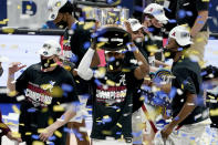 Alabama players celebrate after beating LSU in the championship game of the NCAA college basketball Southeastern Conference Tournament Sunday, March 14, 2021, in Nashville, Tenn. Alabama won 80-79. (AP Photo/Mark Humphrey)