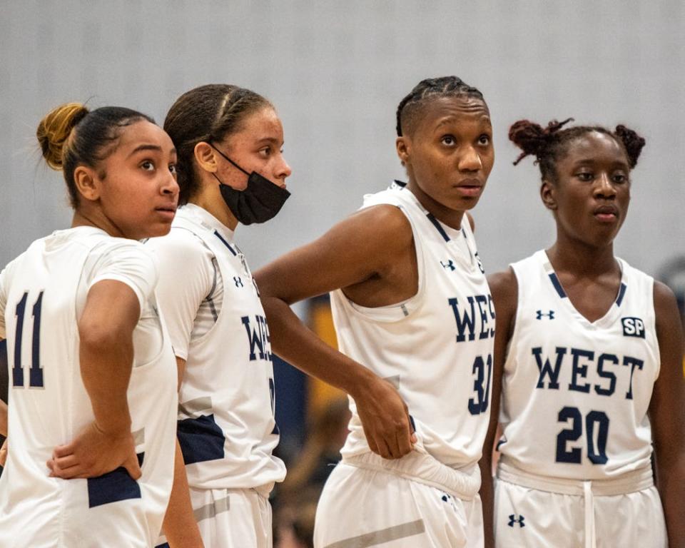 From left to right: Pocono Mountain West girls basketball players Aaliyah Cancel, Jada Bowen, Vatijah Davis and Anaisah Malone gather during a timeout against Parkland in Mount Pocono on Friday, Feb. 11, 2022. Parkland defeated West in the EPC girls basketball quarterfinals, 42-39.